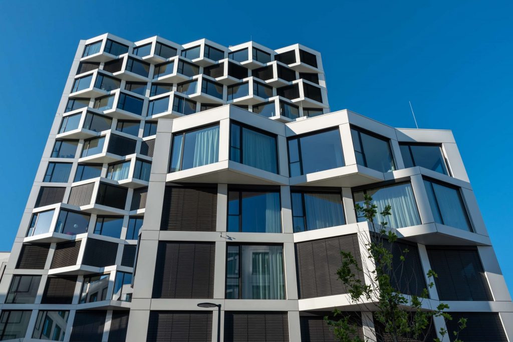 facade-of-modern-high-rise-residential-building-NPW7XTU-e1609136516925.jpg